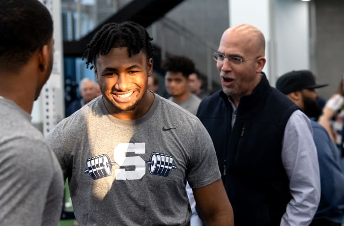 Penn State coach James Franklin encourages running back Nicholas Singleton during a max-out lifting session at the Lasch Football Building.